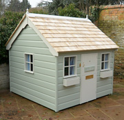 Painted Cottage with shiplap cladding and cedar roof